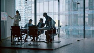 Mature financial analyst telling company development strategy